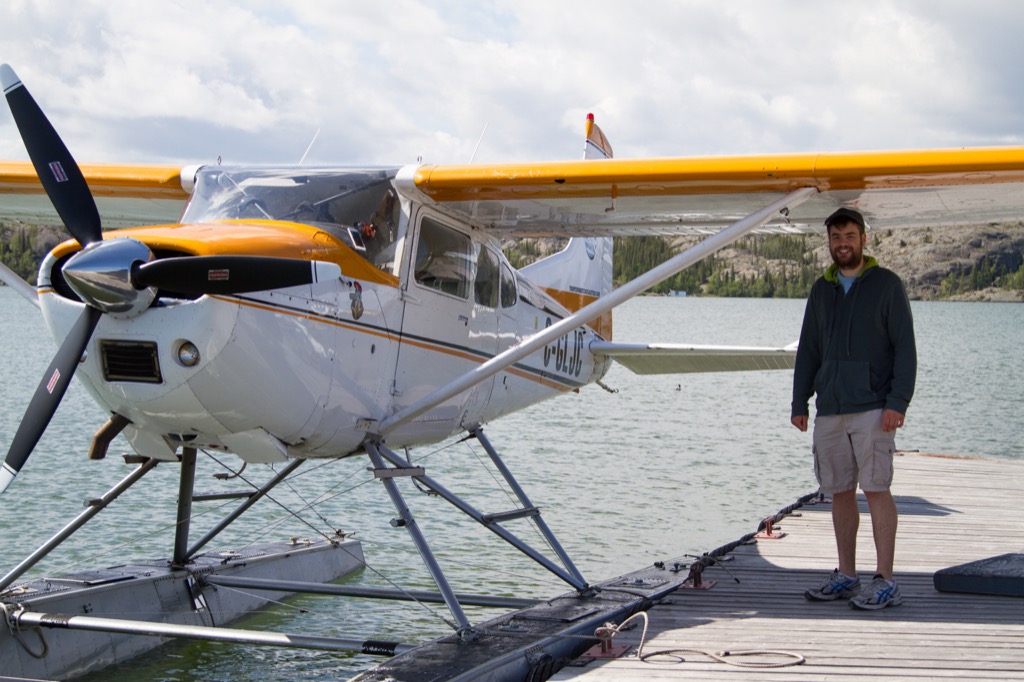 Justin next to the floatplane.